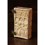 A Small Late 14th/15th Century Carved Ivory Book Cover encasing five boxwood leaves.