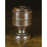 An 18th Century Turned Oak Tobacco Jar & Cover, 6¼ in (16 cm) in height.