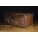 A Small Late 17th/Early 18th Century Boarded Oak Box enriched with lunette carving incorporating