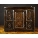 A Late 17th Century Joined Oak Wall Cupboard with central panel door flanked by twin side panels