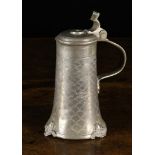 An Early 18th Century Pewter Tankard with hinged lid.
