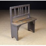 A Small Pine Child's Bench with distressed paint-work.