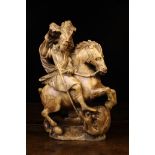 An Alabaster Carving of Saint George & The Dragon, Circa 1600.
