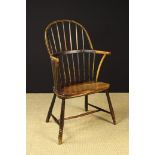 An Early 19th Century South West Country Stick back Windsor Armchair.