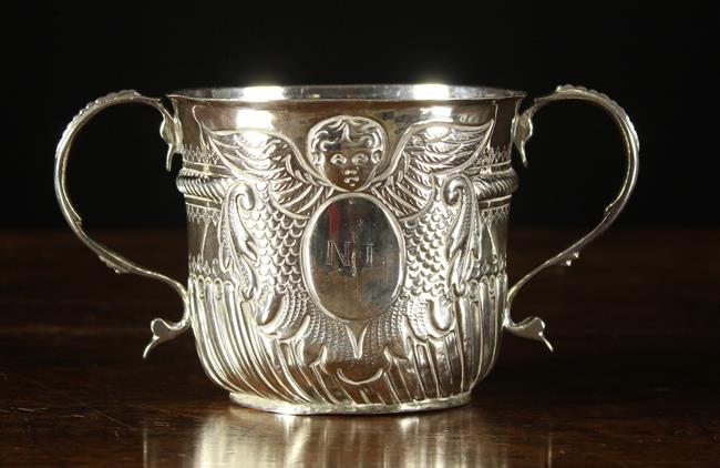 A Queen Anne Silver Loving Mug by John Wisdorne hallmarked London 1707.