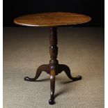 An 18th Century Oak Tilt Top Tripod Table.