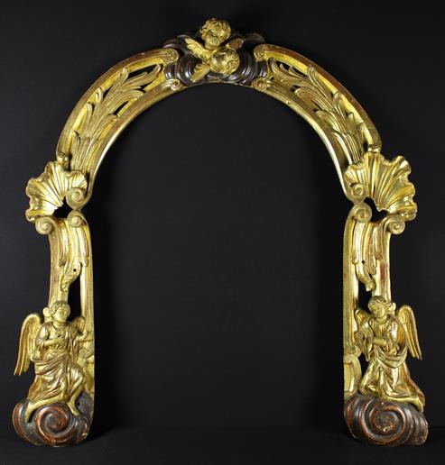 An 18th Century Open Giltwood Arch carved with swept bundles of reeds having bold shell crested