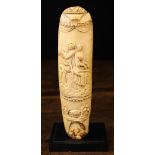 An 18th Century Carved Ivory Snuff Rasp Cover decorated with a couple sat outside below a draped
