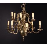 An 18th Century Style Brass Twelve Branch Chandelier wired for electric.