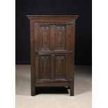 A Small 16th Century Flemish Oak Floor Standing Cupboard with carved parchemin panels,