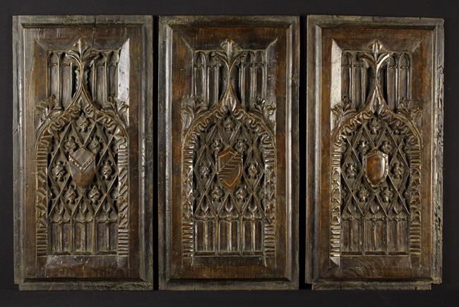 A Set of Six Carved Gothic Oak Panels.