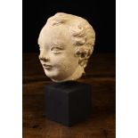 A Small 17th Century Carved Stone Head,