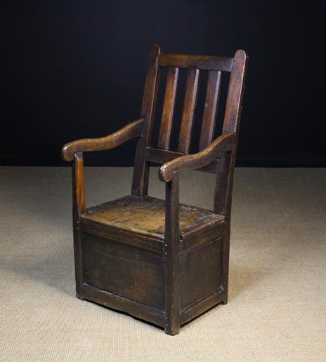 An 18th Century Oak Box Seat Armchair wi