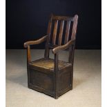 An 18th Century Oak Box Seat Armchair wi