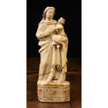An Alabaster Carving of Madonna & Child