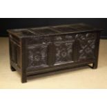 A 17th Century Carved Oak Coffer dated 1
