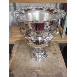 A large silver plated ornate champagne/wine cooler - Height 36cm