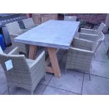 A Bramblecrest garden table with a concrete/resin top and a teak base with six rattan chairs -