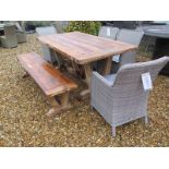 A Bramblecrest Kuta 180cm table with a bench and four armchairs