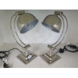 A pair of almost new chrome plated lamps in working order