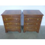 A new pair of walnut effect bedside chests with brushing slide over three long drawers raised on