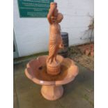 A terracotta "Water carrier" water feature - by Henri Studio inc 1979 - Height 1.