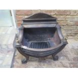 A Regency style cast iron fire basket with brass decoration - Height of back 64cm x Width 58cm x