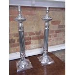 A pair of silver plated reeded table lamps - height 60cm