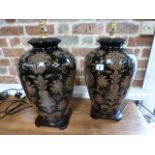 A pair of urn shaped ceramic table lamps,