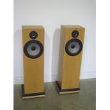 A pair of good quality loud speakers on a granite base - Height 106cm