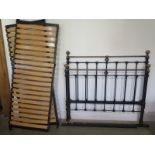 A Victorian style metal and brass double bed with slatted base