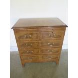 A good quality 19th century style small walnut chest with a brushing slide above five drawers on