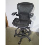 An ergonomic modern tall designer desk/office chair