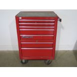 A snap on tool cabinet with a good selection of modern tools including some snap items