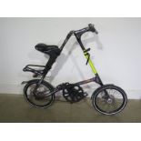 A Strida Evo belt driven fold up bicycle - as new