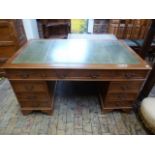 A modern yew veneer nine drawer desk with a leather inset top - 150cm x 90cm