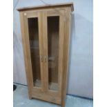 An oak display cabinet - Width 85cm x Depth 35cm x Height 180cm - no shelves