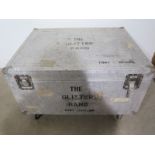 A steel drum box sign written The Glitter Band on casters - Width 110cm x Depth 88cm x Height 66cm