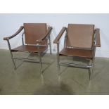 A pair of Wassily style modern chrome and tan leather designer armchair