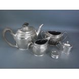 A silver hallmarked tea set consisting of teapot, milk and sugar, mark for London 1912-13,