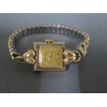 A 9ct yellow gold cased ladies Longines wristwatch Arabic numerals at even numbers on gold plated