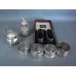 Five silver hallmarked napkin rings, a silver peppers, one plated napkin ring - Weight approx.