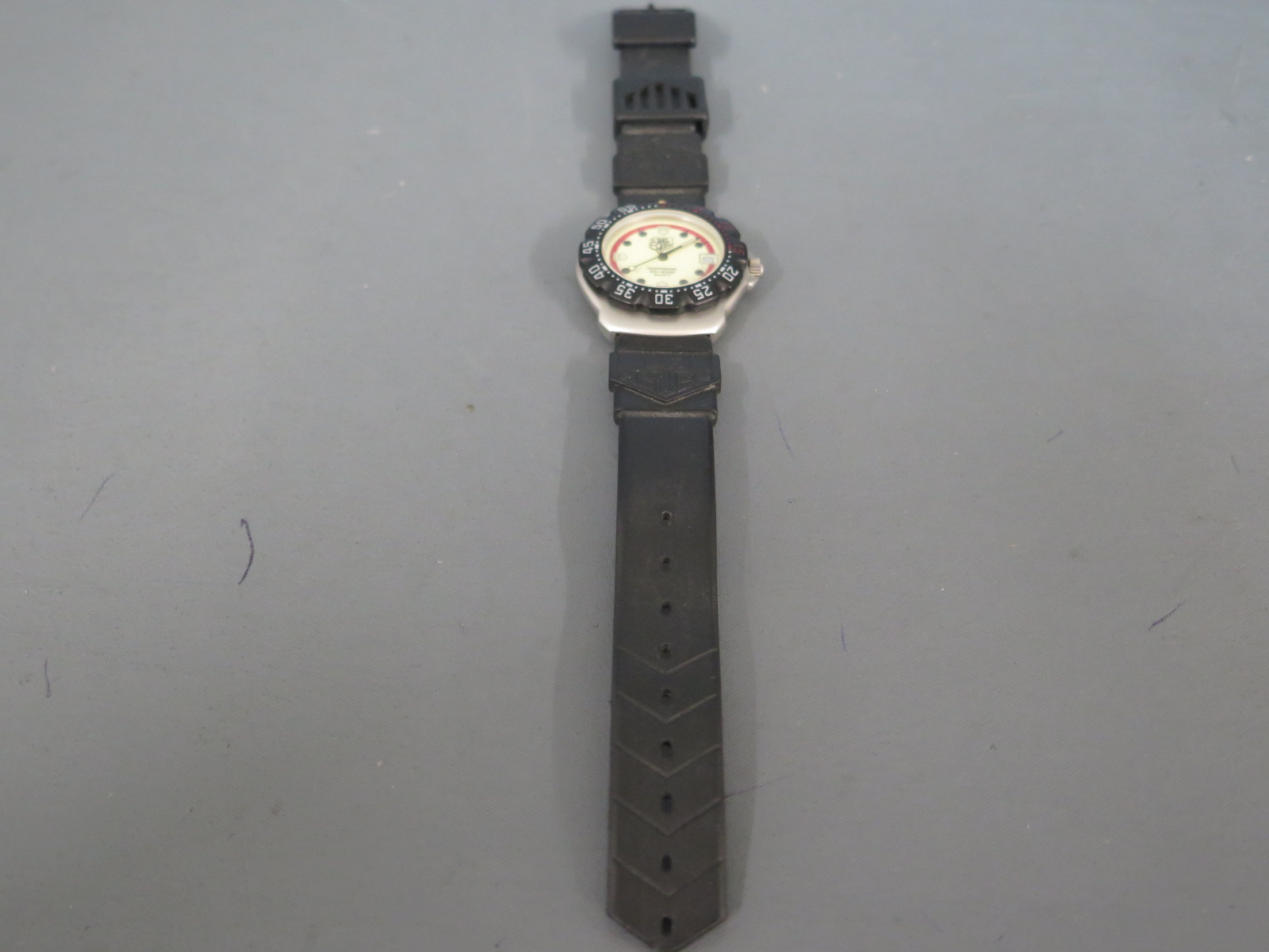 A Tag Heuer gents professional 200 meters wristwatch on Tag Heuer strap, quartz movement,