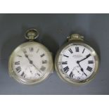 Two white metal cased open faced pocket watches, both with white enamel dials,