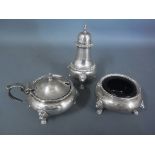 A silver hallmarked cruet set consisting of a salt, mustard,