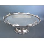 A hallmarked silver bowl on single pedestal, foliate decoration to top and bottom rims,