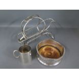 A silver plated bottle stand,