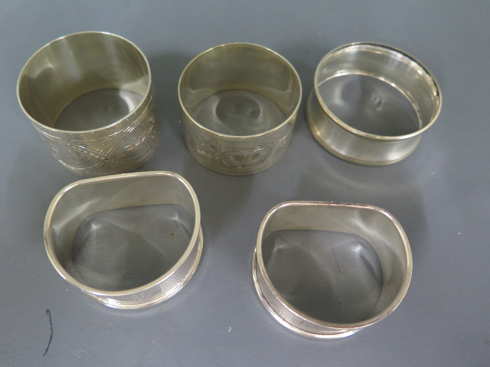 Three silver hallmarked napkin rings and two silver plated - Image 2 of 2