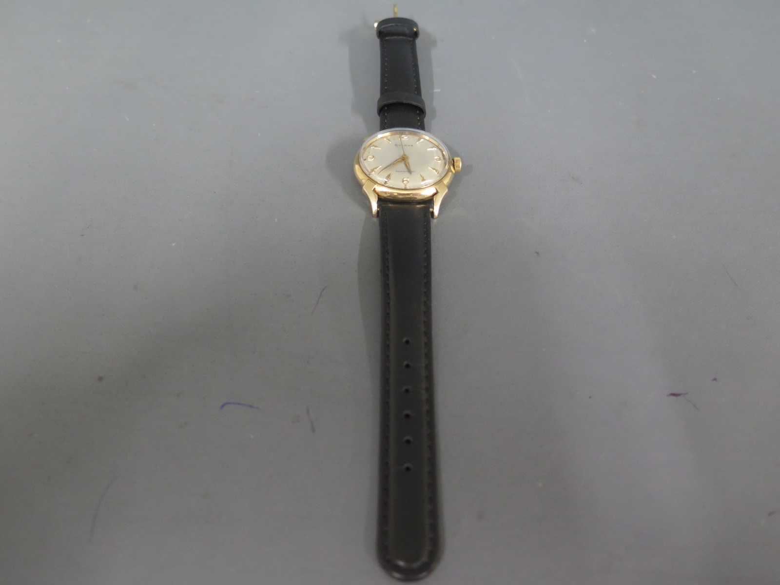 A Bulova gents gold plated cased automatic wristwatch Arabic numerals at 12, 3, 6 & 9,