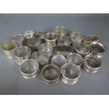 Twenty two silver hallmarked napkin rings, varying design and size - Weight approx.